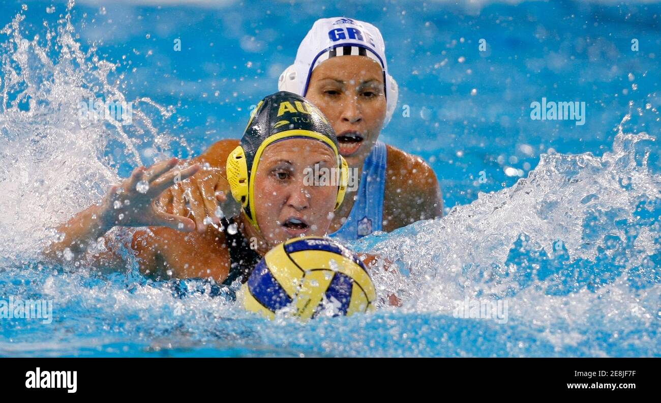 Evangelia Moraitidou of Greece (back) and Nikita Cuffe of Australia fight for the ball during their women's preliminary round Group B water polo match at the Beijing 2008 Olympic Games August 11, 2008.    REUTERS/Tim Wimborne (CHINA) Stock Photo