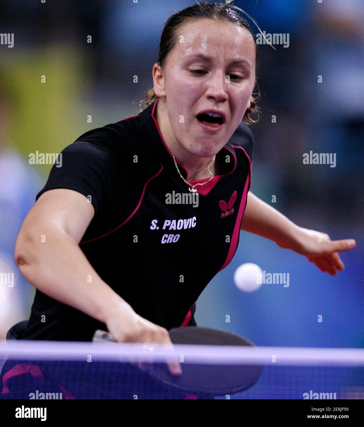 Sandra Paovic of Croatia returns the ball to Jian Fang Lay of Australia during her women's singles first round table tennis match at the Beijing 2008 Olympic Games August 19, 2008.     REUTERS/Beawiharta (CHINA) Stock Photo