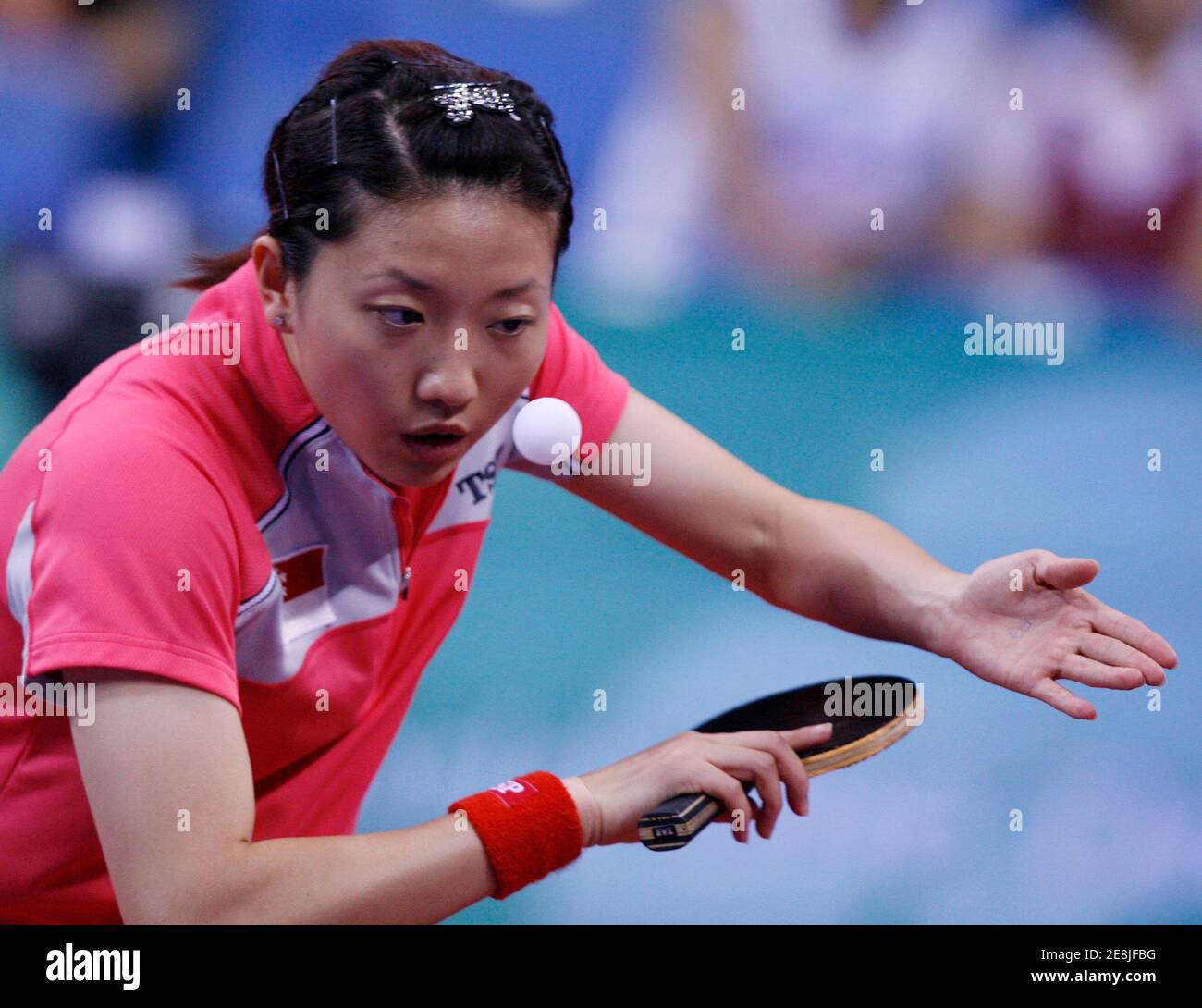 Li Jia Wei of Singapore serves to Tamara Boros of Croatia during her women's singles third round table tennis match against at the Beijing 2008 Olympic Games August 20, 2008     REUTERS/Beawiharta (CHINA) Stock Photo