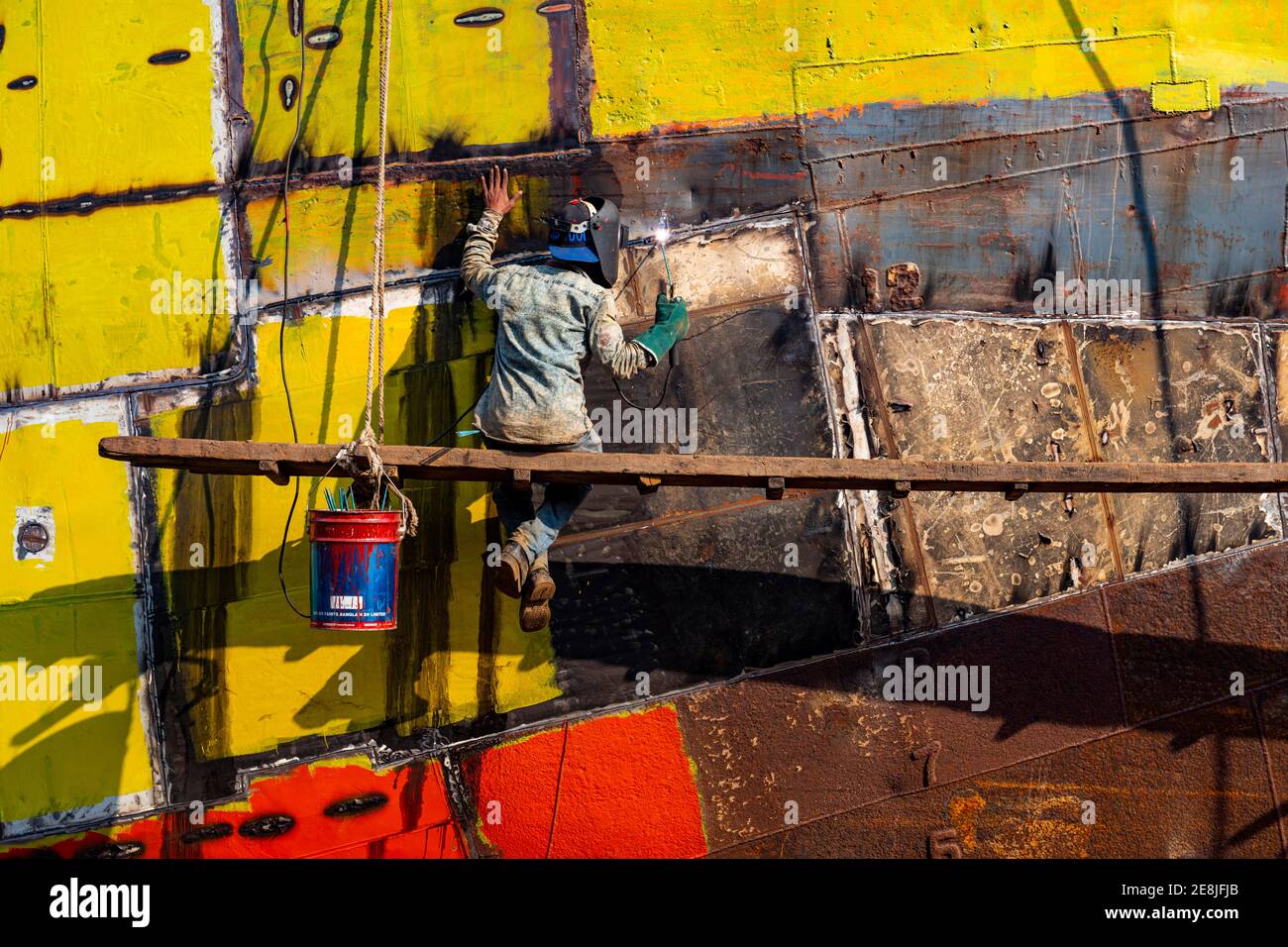 Man welding on a ship, shipwreck cemetery, Port of Dhaka, Bangladesh Stock Photo
