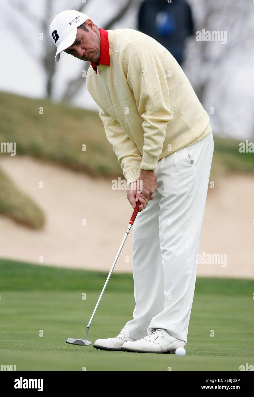 Scott Hend of Australia putts for a par on the 16th hole during the first round of the Ballantine's Championship golf tournament at the Pinx Golf Club in Seogwipo, on Jeju Island, March 13, 2008.  REUTERS/Jo Yong-Hak (SOUTH KOREA) Stock Photo