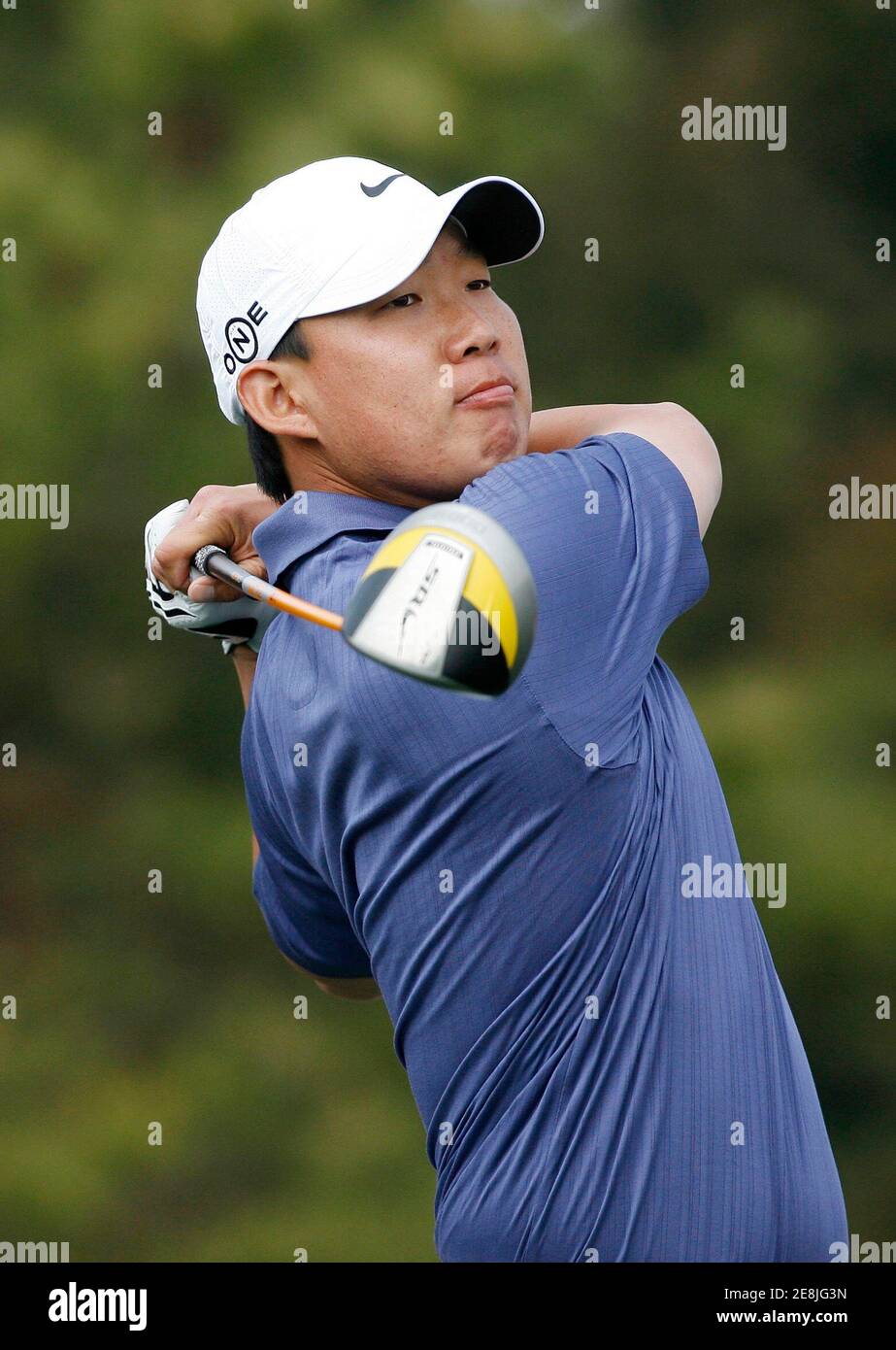 Anthony Kim of the U.S. tees off on the 7th hole during the final round of the EPGA Ballantine's Championship golf tournament at the Pinx Golf Club in Seogwipo on Jeju Island March 16, 2008.  REUTERS/Jo Yong-Hak (SOUTH KOREA) Stock Photo