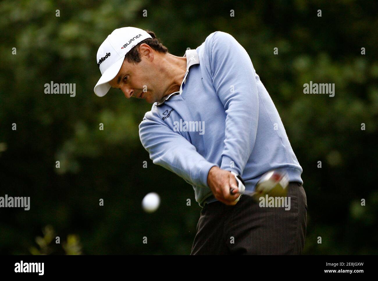 England's Simon Khan tees off at the eighteenth hole during the third round of the Scottish Open golf tournament at Loch Lommond near Glasgow, Scotland, July 12, 2008. REUTERS/David Moir (BRITAIN) Stock Photo