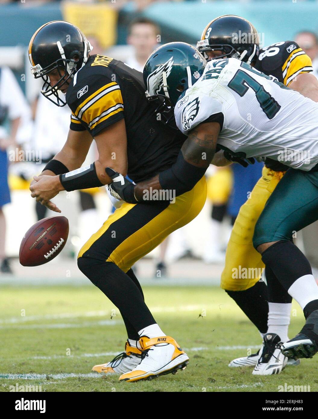 Pittsburgh Steelers quarterback Ben Roethlisberger (L) fumbles while being  tackled by the Philadelphia Eagles defensive end Jaqua Parker (R) during  the second quarter of NFL football game action in Philadelphia,  Pennsylvania, September