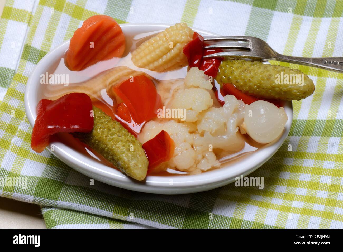 Mixed pickles with carrots, cauliflower, gherkins, onions and corn