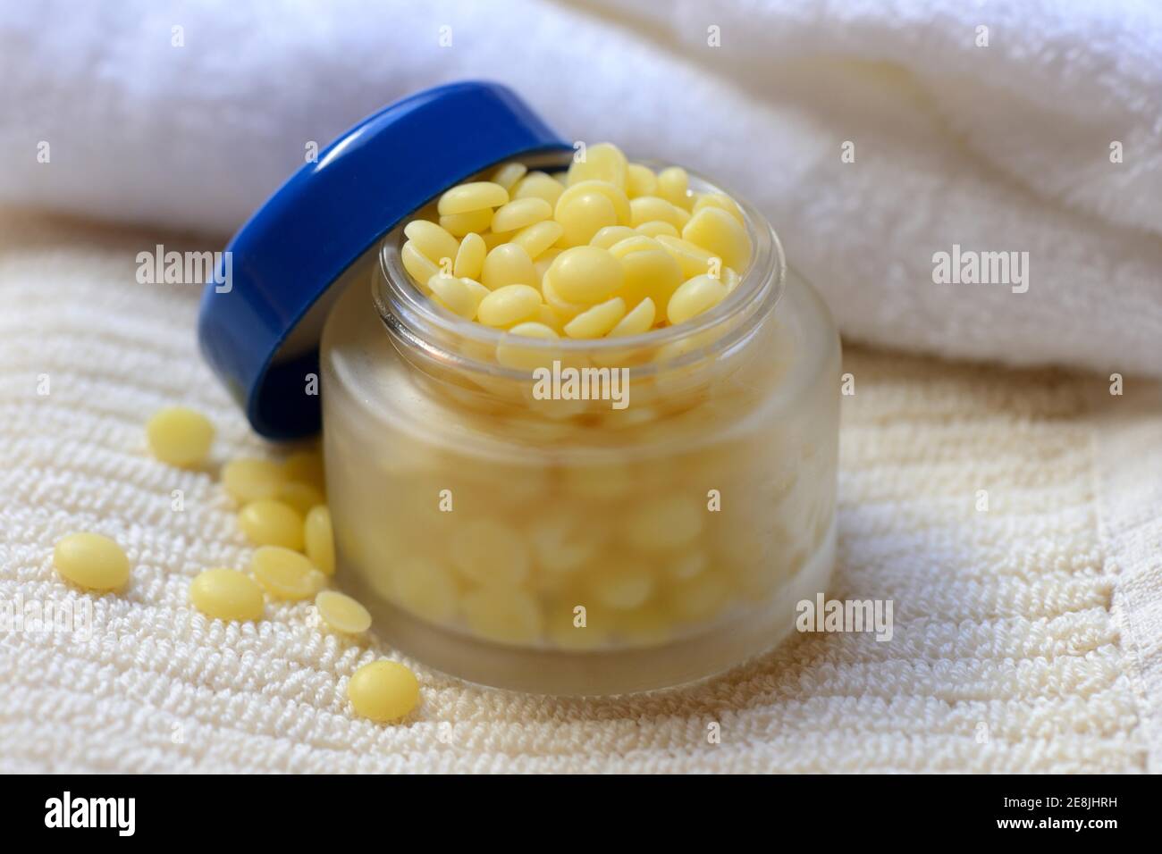 Cocoa butter in glass jar( Theobroma cacao) , cocoa fat, oleum cacao Stock Photo