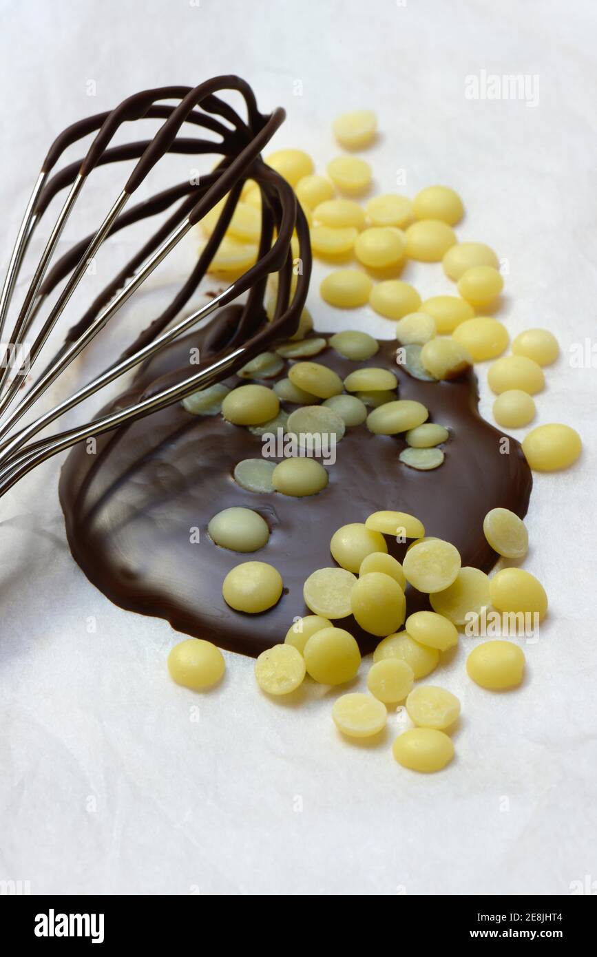 Cocoa butter and melted chocolate coating with whisk( Theobroma cacao) , cocoa, melted, chocolate ingredient Stock Photo