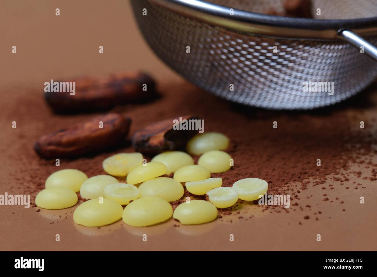 Cocoa powder in sieve and cocoa beans( Theobroma cacao) , cocoa, chocolate ingredient Stock Photo