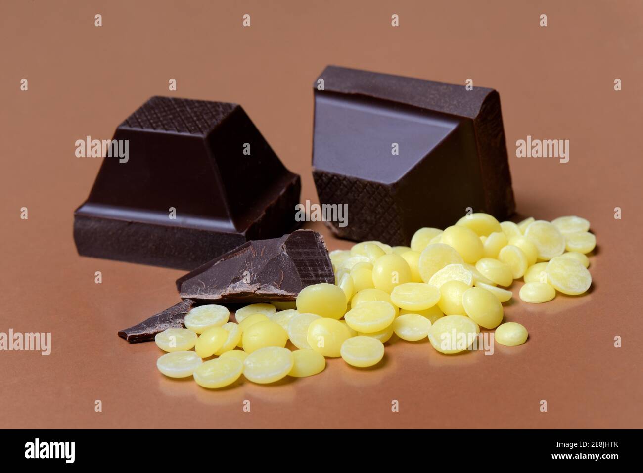 Cocoa butter chips and chocolate blocks, couverture( Theobroma cacao) , chocolate, chocolate ingredient Stock Photo