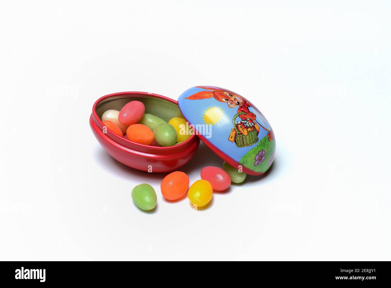 Sugar eggs in tin egg with rabbit figure Stock Photo