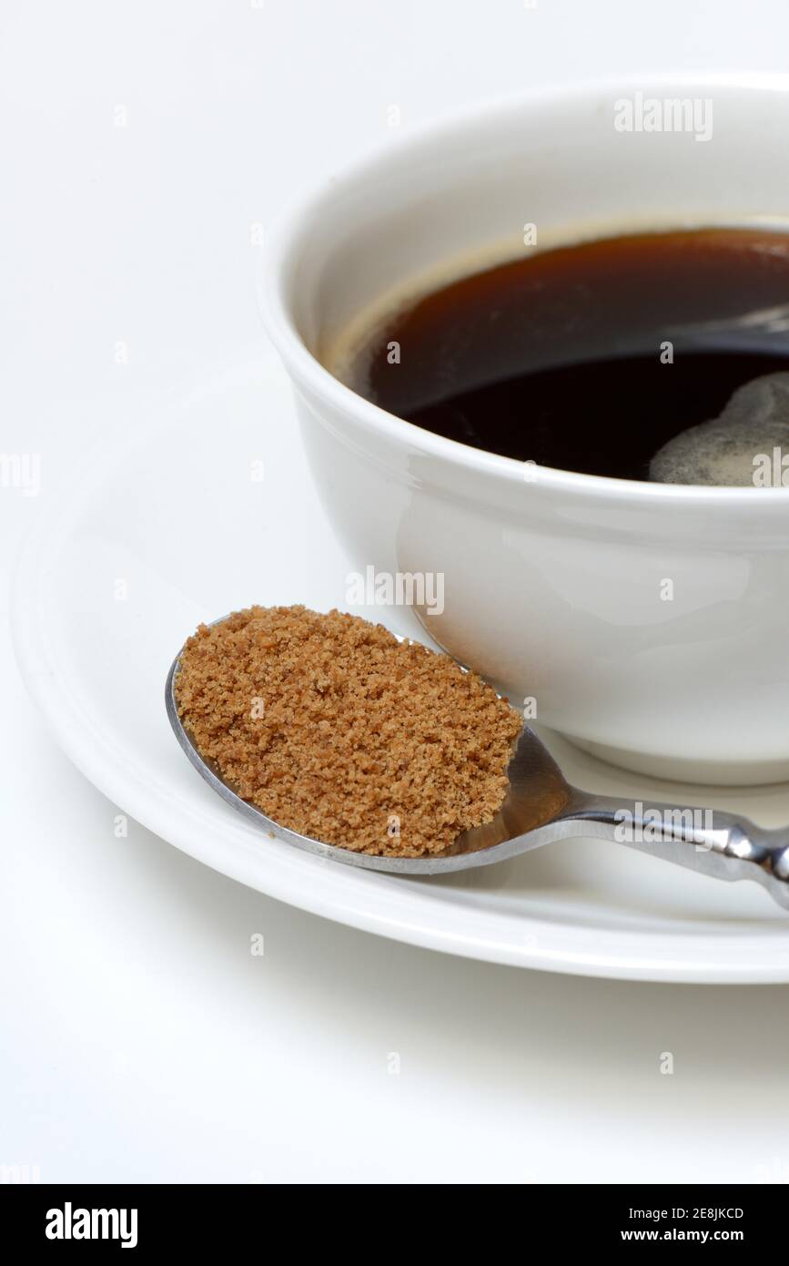 Spoon with coconut blossom sugar, coffee cup with coffee Stock Photo