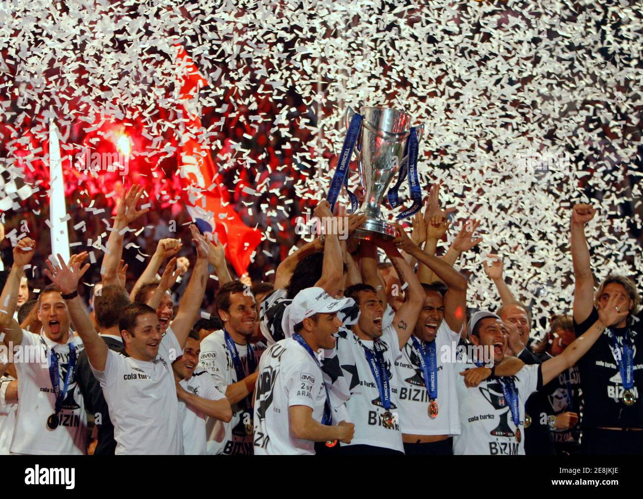 Besiktas players lift the Turkish Super League soccer championship trophy during a celebration at Inonu stadium in Istanbul May 31, 2009.REUTERS/Murad Sezer (TURKEY SPORT SOCCER) Stock Photo