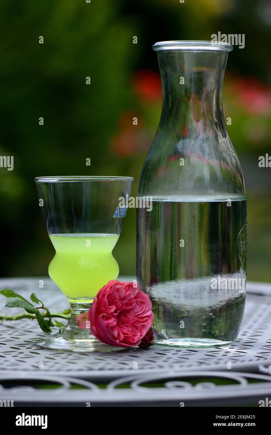 Glass of Absinthe with water carafe, Green Fairy Stock Photo