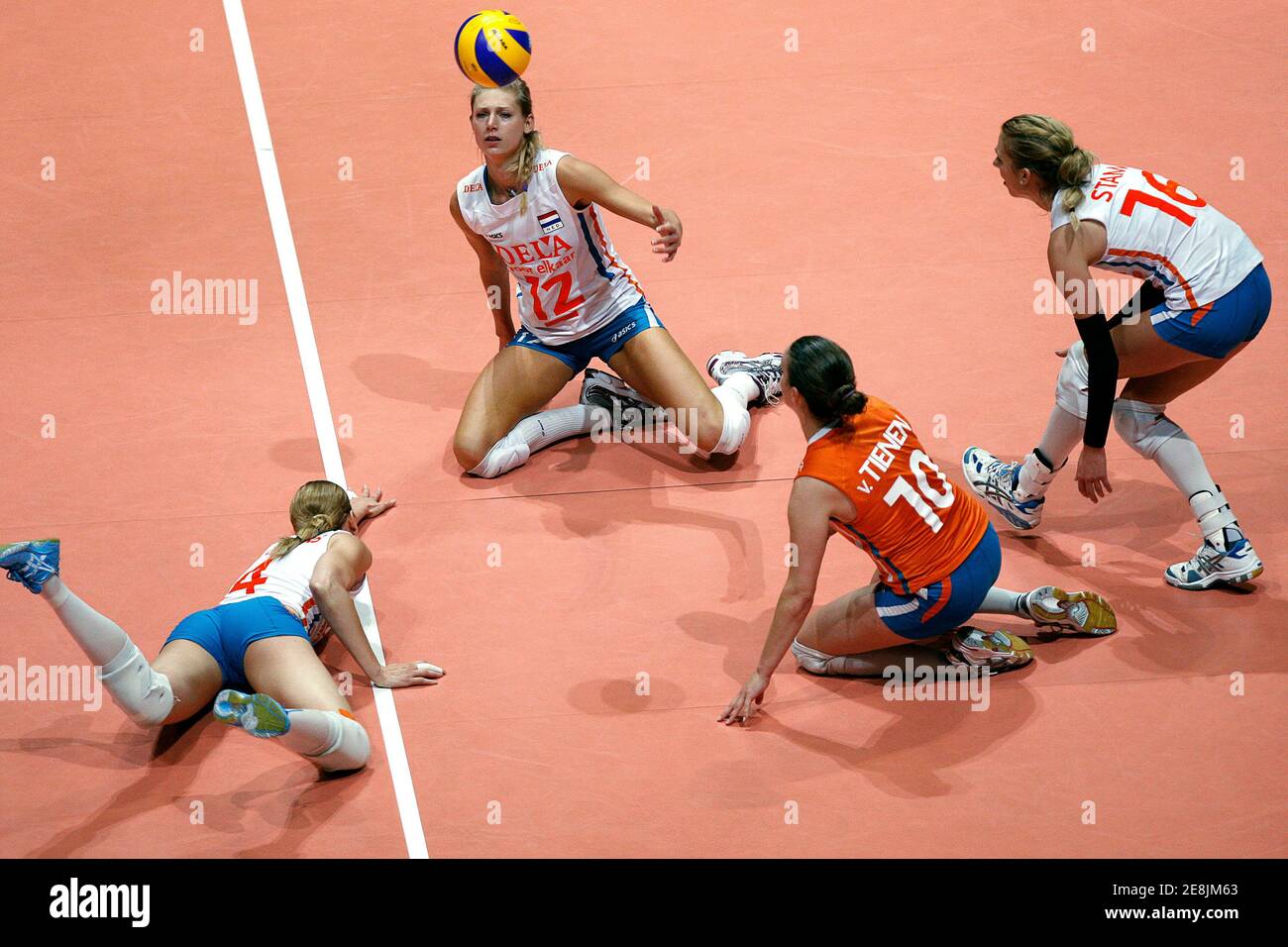 Manon Flier (12), Chaine Staelens (4), Janneke Van Tienen (10) and Debby Stam (16) of the Netherlands go for the ball during the team's FIVB World Grand Prix women's volleyball match against the Dominican Republic in Hong Kong August 15, 2009.       REUTERS/Tyrone Siu    (CHINA SPORT VOLLEYBALL) Stock Photo