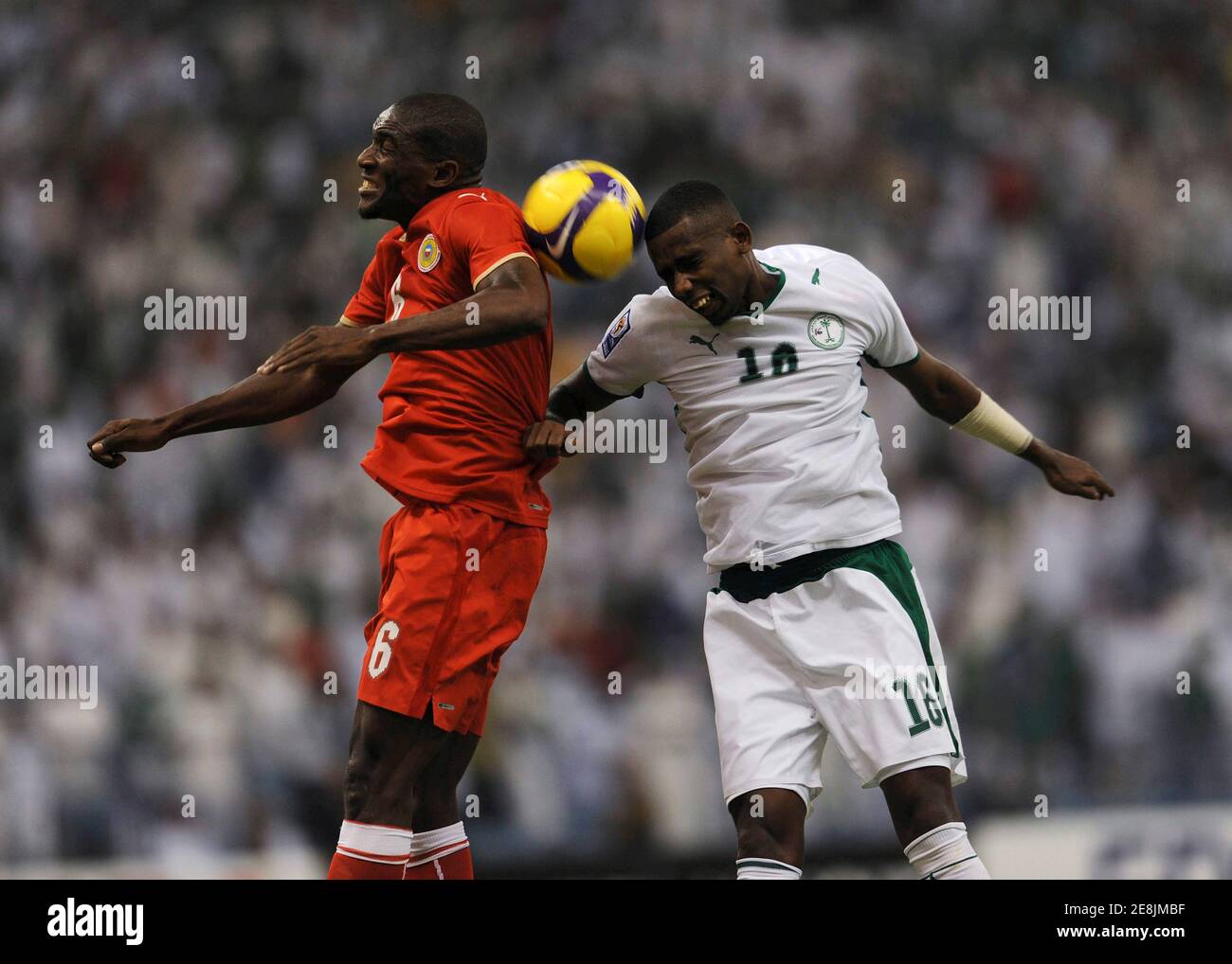 Hamad Al Montashari (R) of Saudi Arabia fights for the ball with Jaycee Okwunwanne of Bahrain during their World Cup 2010 qualifying soccer match in Riyadh September 9, 2009. REUTERS/Fahad Shadeed (SAUDI ARABIA SPORT SOCCER) Stock Photo