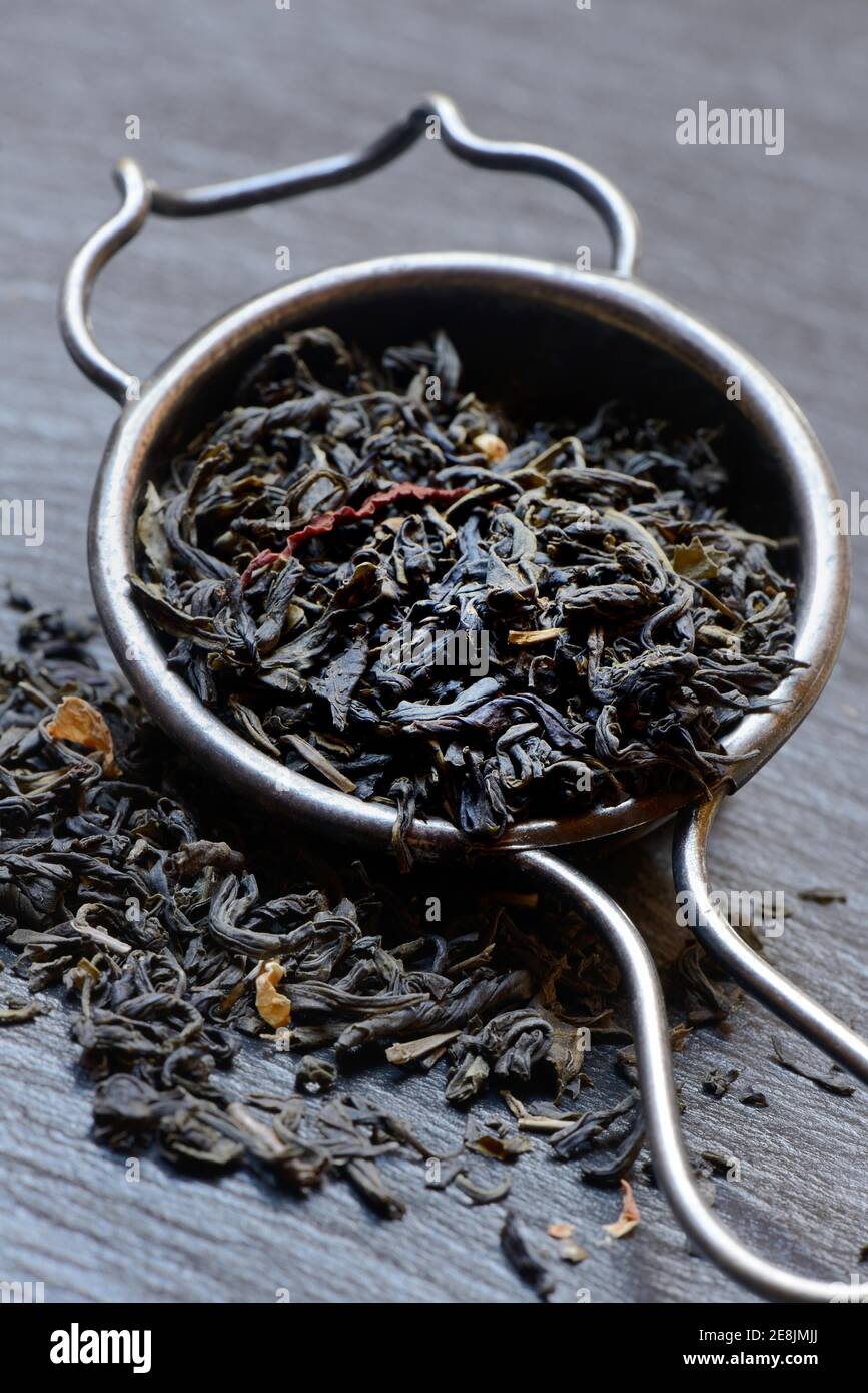 Green tea in tea strainer Stock Photo
