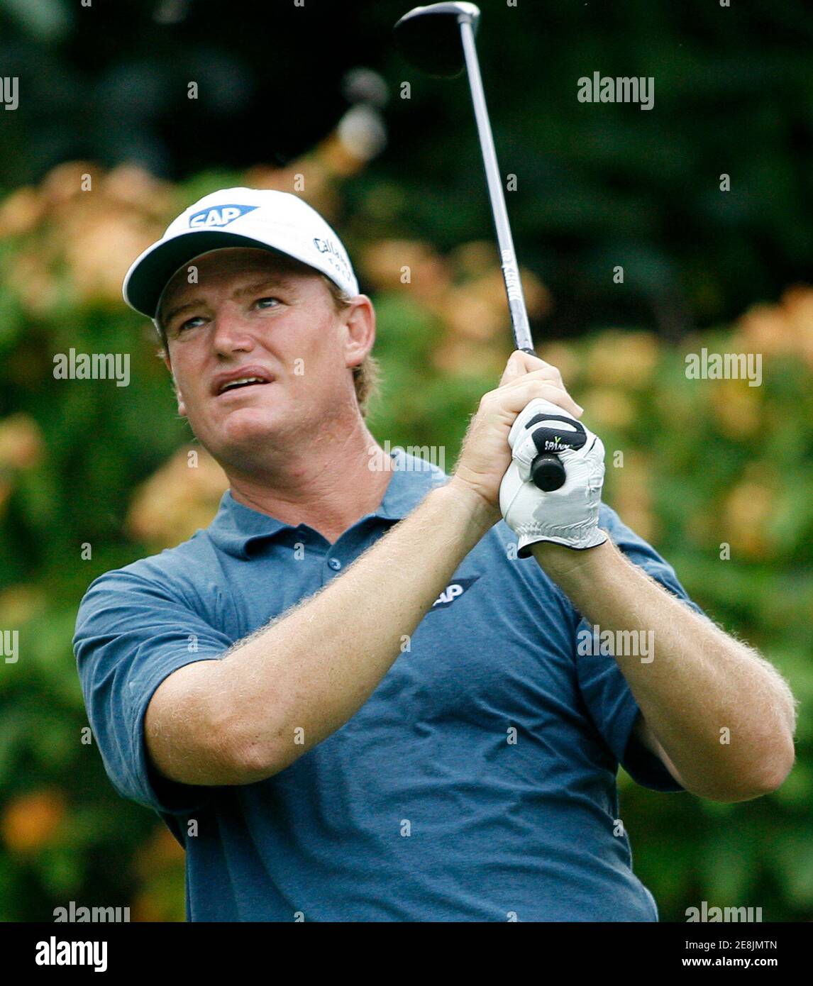 Ernie Els of South Africa tees off on the third hole during the second round of the Barclays Singapore Open golf tournament at the Serapong golf course on Sentosa island in Singapore October 30, 2009. REUTERS/Angeline Tan (SINGAPORE SPORT GOLF) Stock Photo