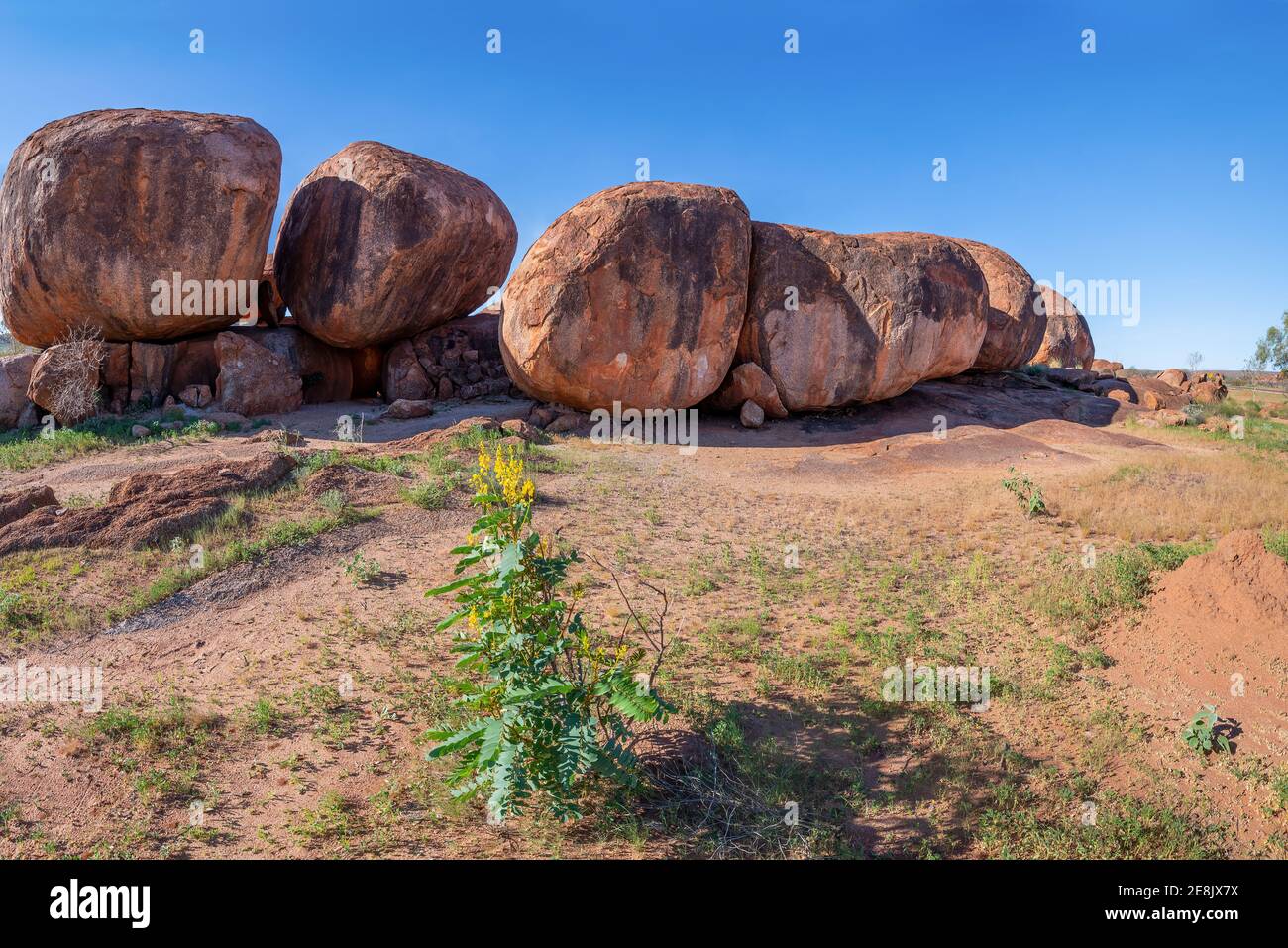 The Devils Marbles are a natural rock formation in the outback of the Northern Territory, Australia. Stock Photo