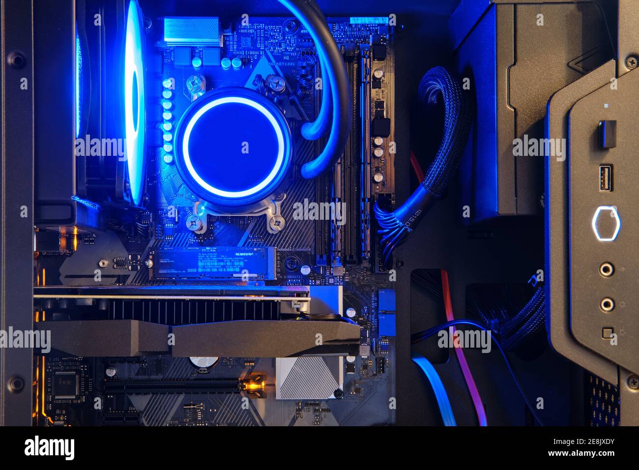 Computer parts inside pc with ice blue led liquid cooling Stock Photo -  Alamy
