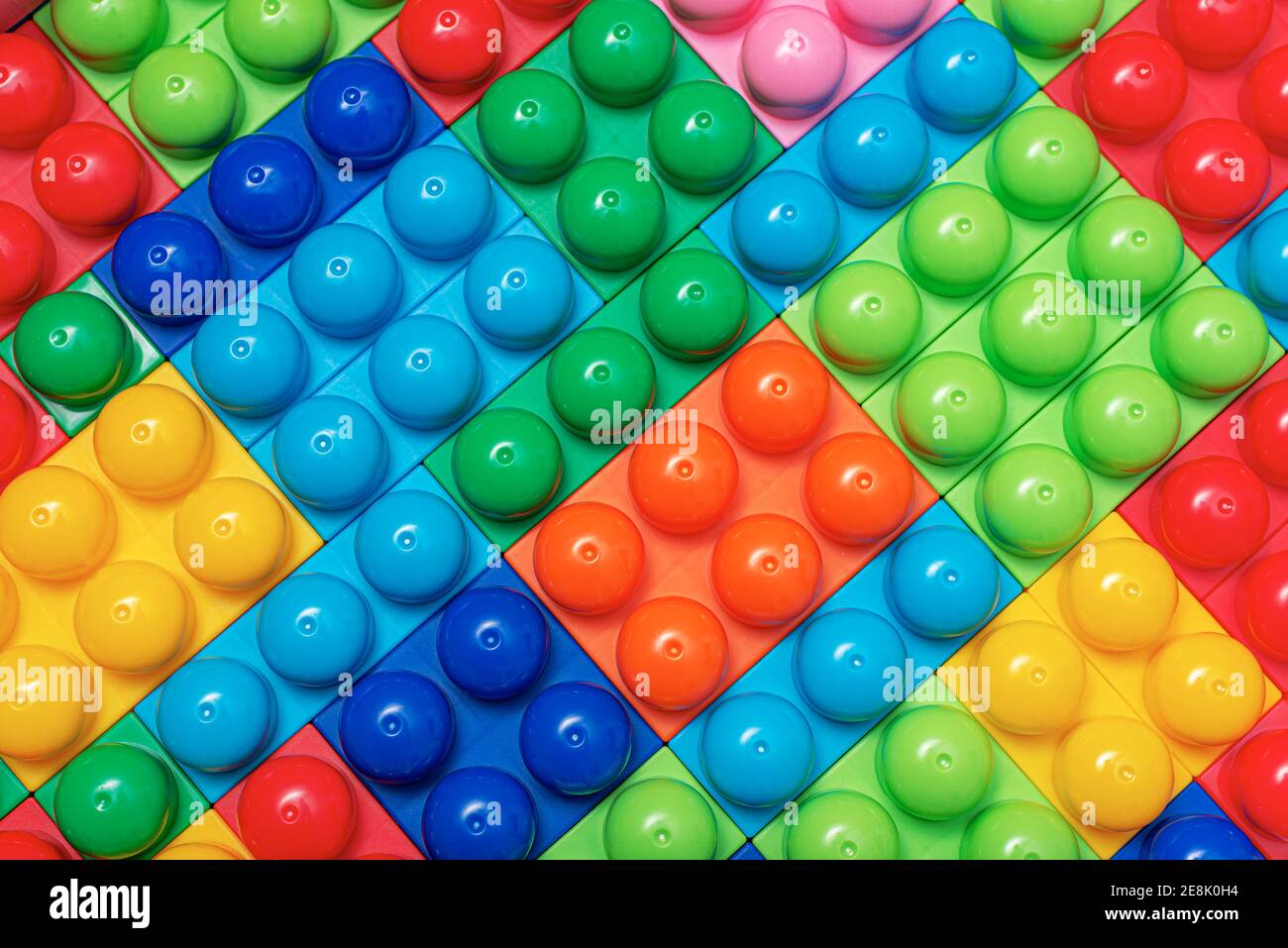 Children's multi-colored constructor as an abstract background. Multicolored blocks close-up. Stock Photo