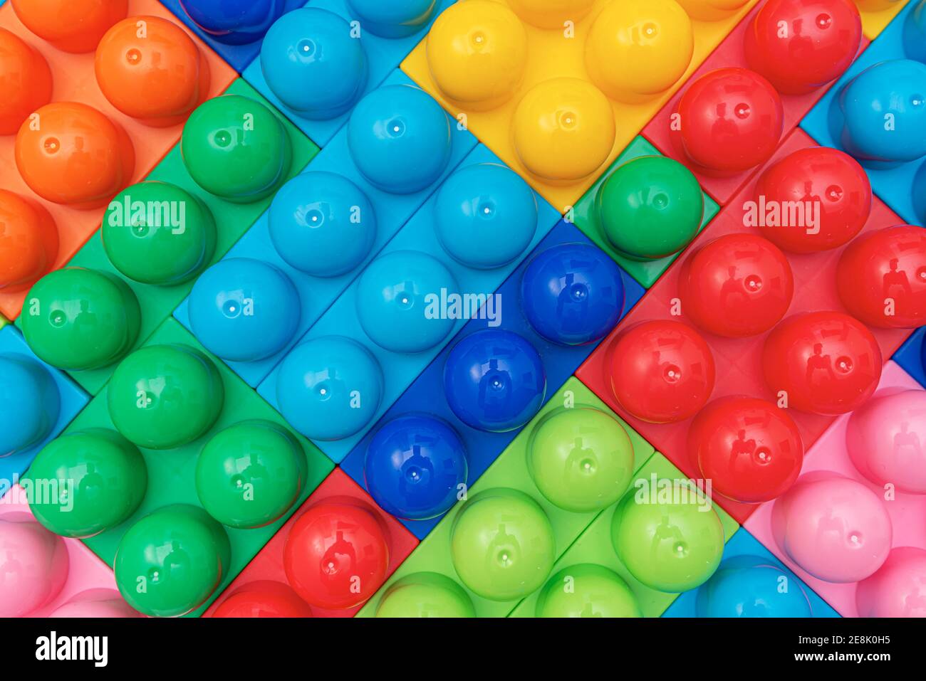 Children's multi-colored constructor as an abstract background. Multicolored blocks close-up. Stock Photo