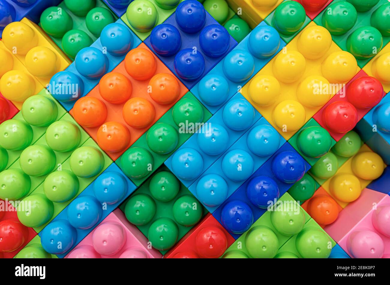 Children's multi-colored constructor as an abstract background. Multicolored blocks close-up. Stock Photo