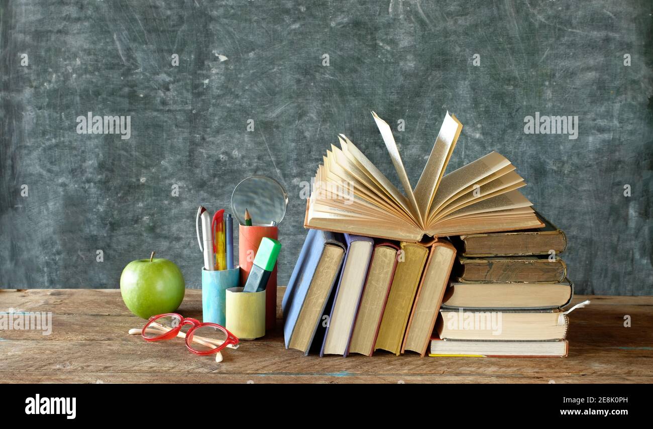 Back to school, reopening schools after corona lockdown, school supplies,books, blackboard with welcome message, concept Stock Photo