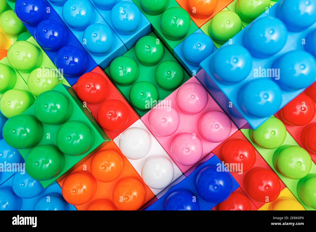 Children's multi-colored constructor as an abstract background. Multicolored blocks close-up. Stock Photo