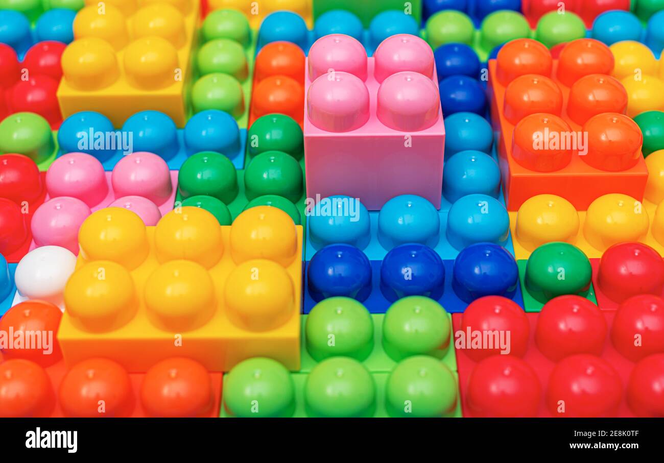 Children's multi-colored constructor as an abstract background. Multicolored blocks close-up. Stock Photo