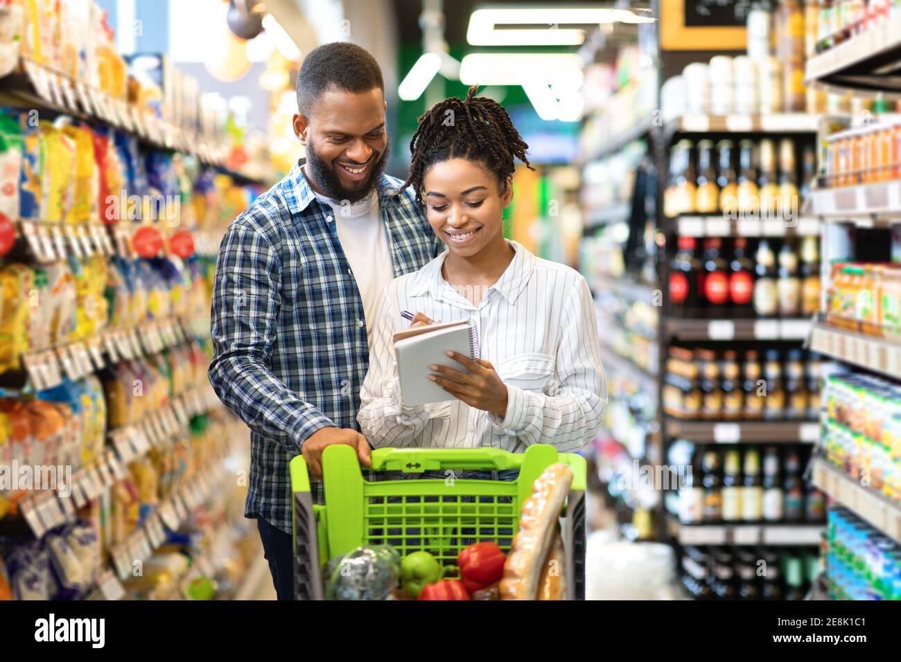 Happy Customers On Grocery Shopping, African Spouses Walking In