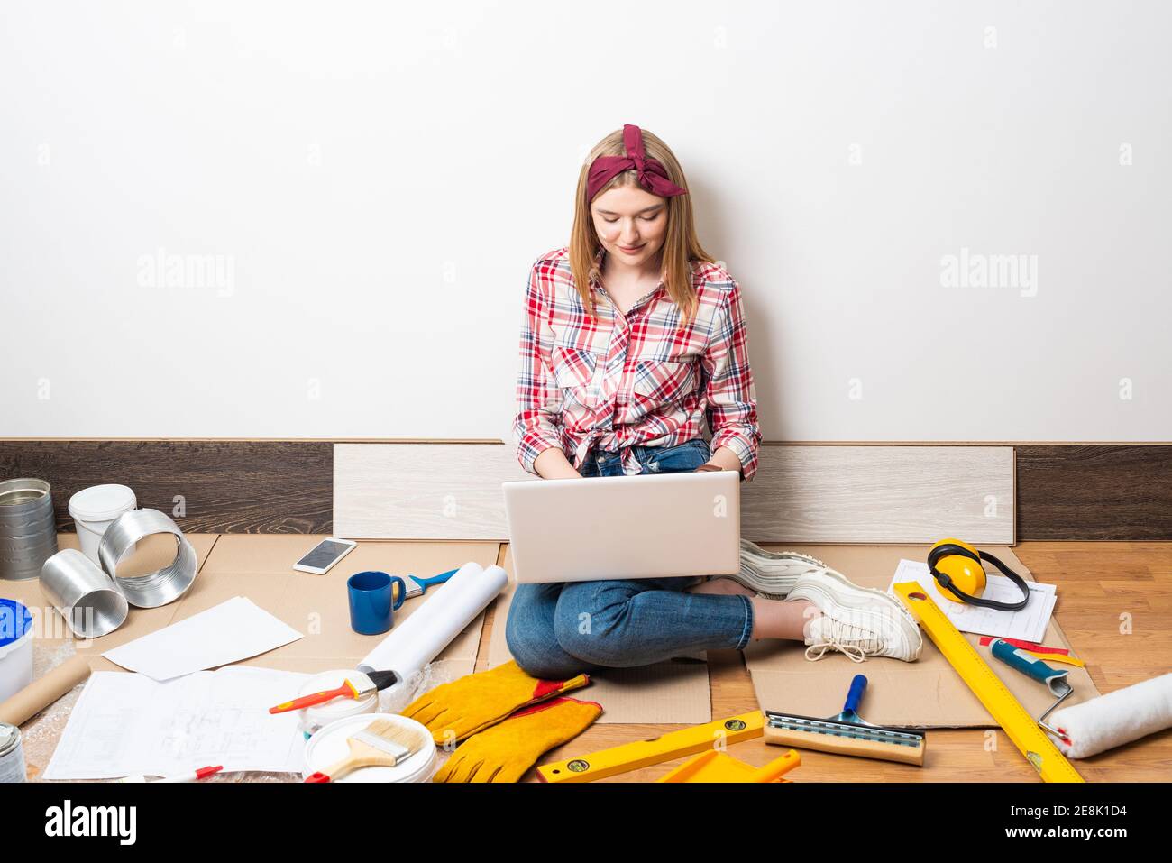 Beautiful girl using laptop computer at home Stock Photo - Alamy
