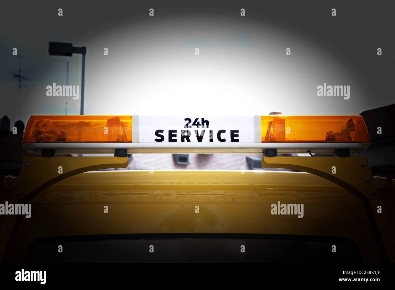 Warning light bar on the roof of a car with the inscription 24 hour