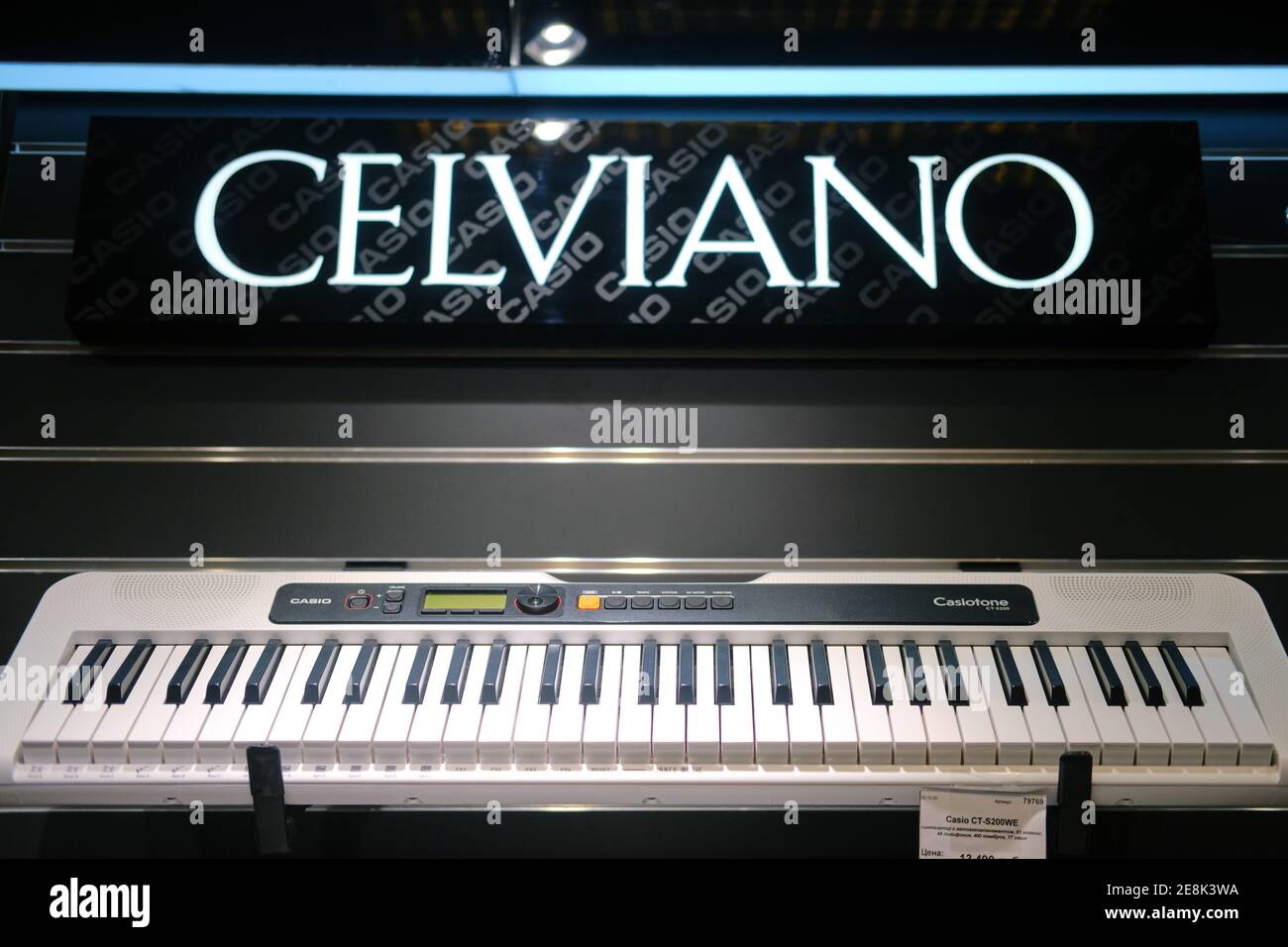 White synthesizers Casio, electronic piano Celviano in musical store. Stock Photo