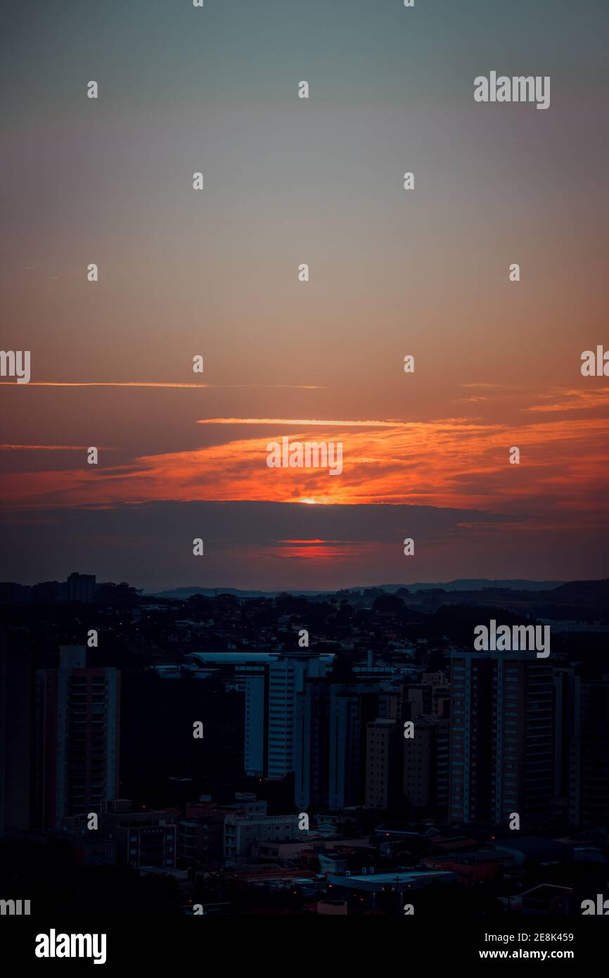 Sunset skyline city background Stock Photo - Alamy