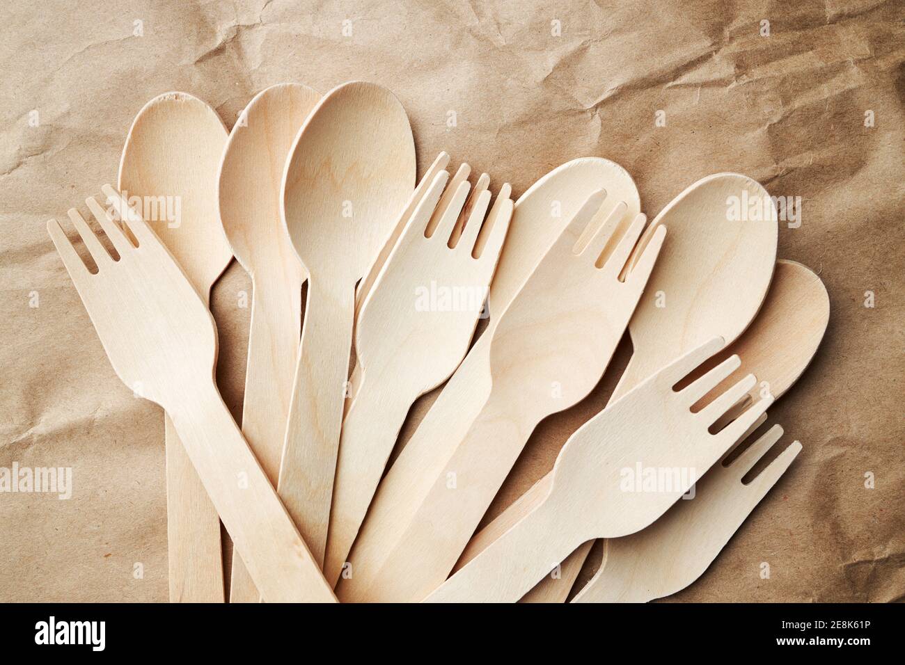 eco friendly disposable kitchenware utensils on paper background. look