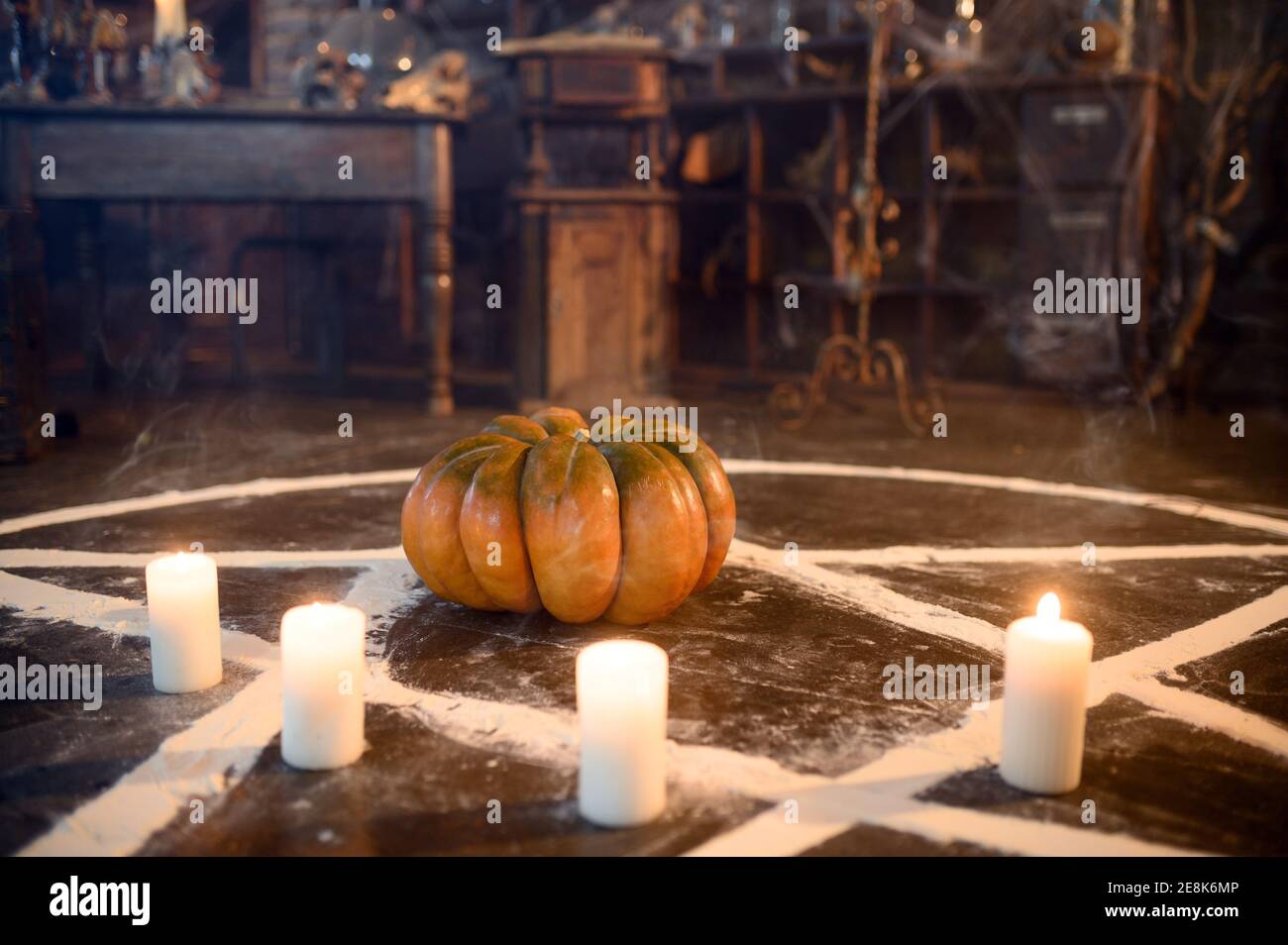 Magic circle with pumpkin and candles, closeup Stock Photo