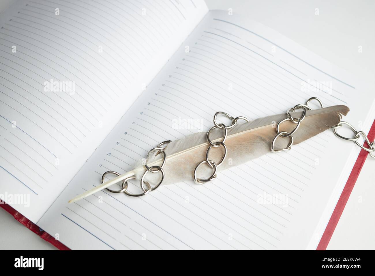 red empty book or diary in chains. information security concept. top view Stock Photo