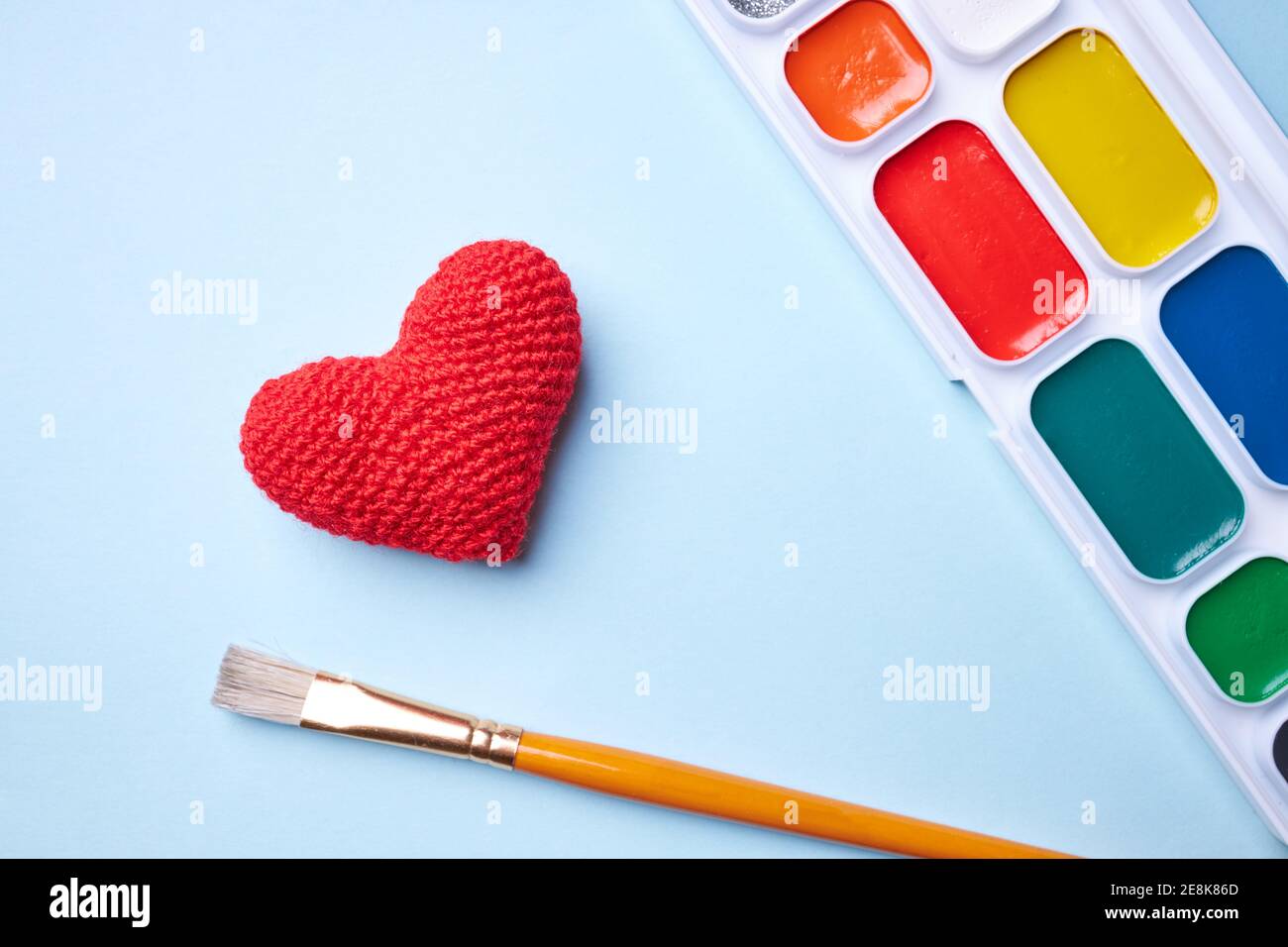 a paints with tassel with heart shape. copy space for text. love to creativity concept Stock Photo