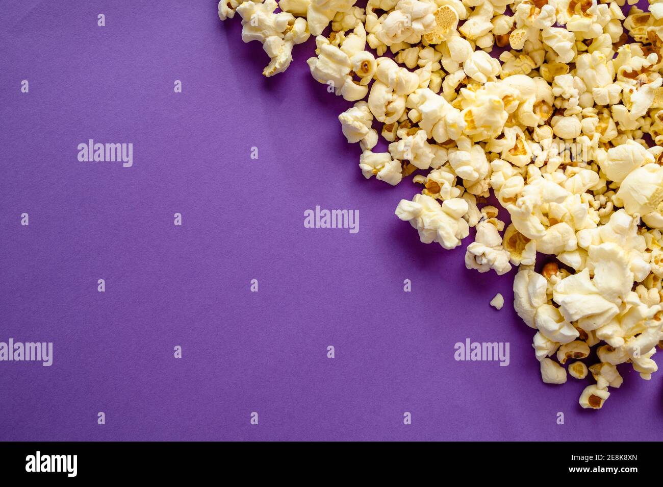 Popcorn border isolated on purple background Stock Photo