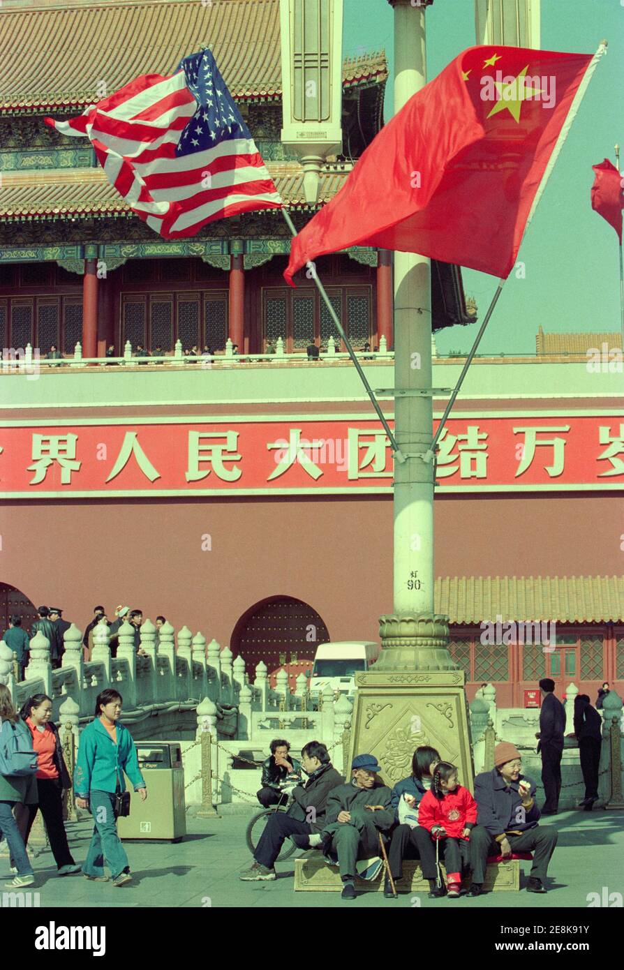 The Chinese and American flags fly over the area around Tiananmen Square during the days when American President George W. Bush visits China. 2002 Stock Photo