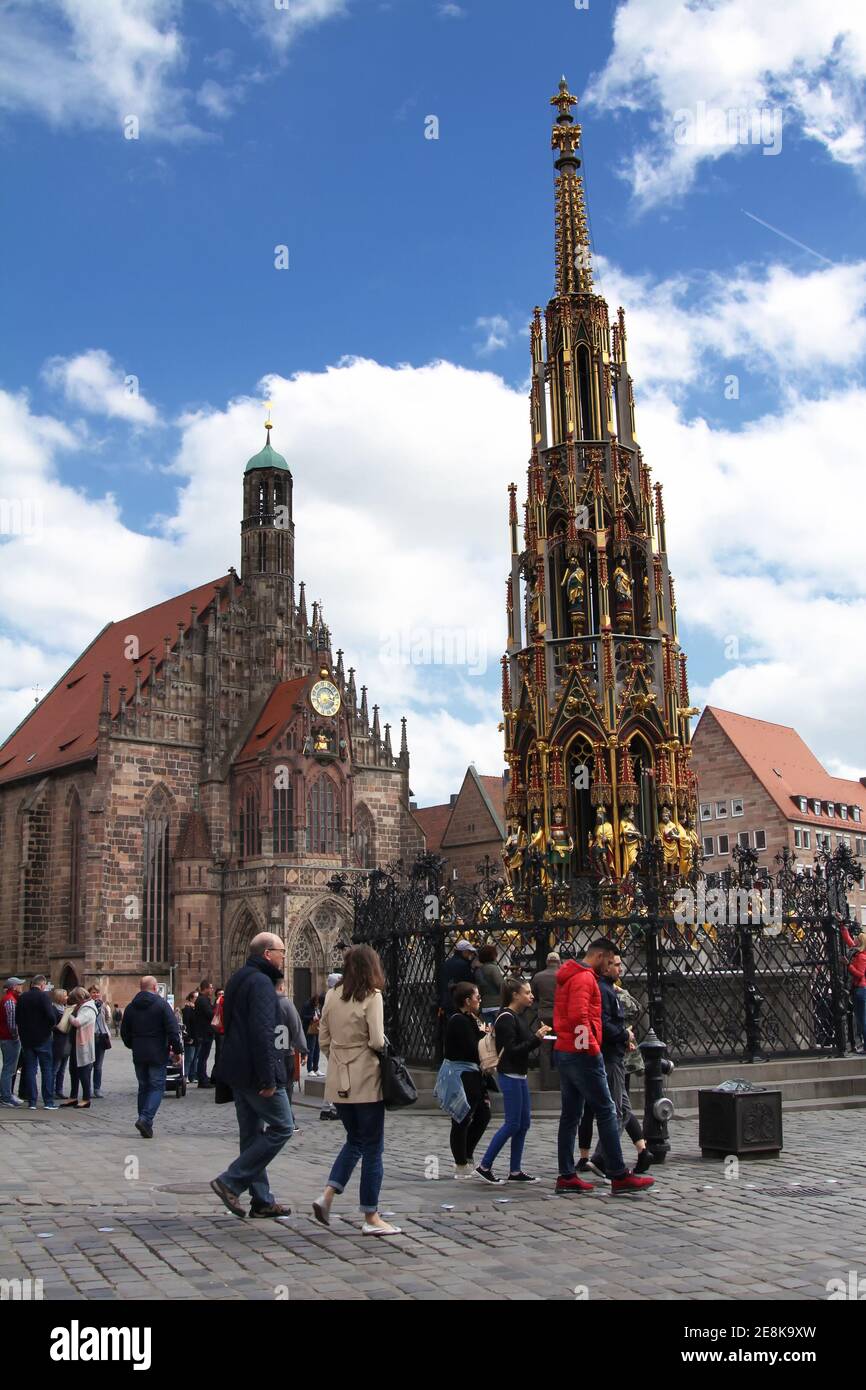 Nurnberg, Beautiful fountain (Schoner Brunnen) and statue. 19 meters high Schoner Brunnen - 14th-century fountain located on Nuremberg's main market. Stock Photo