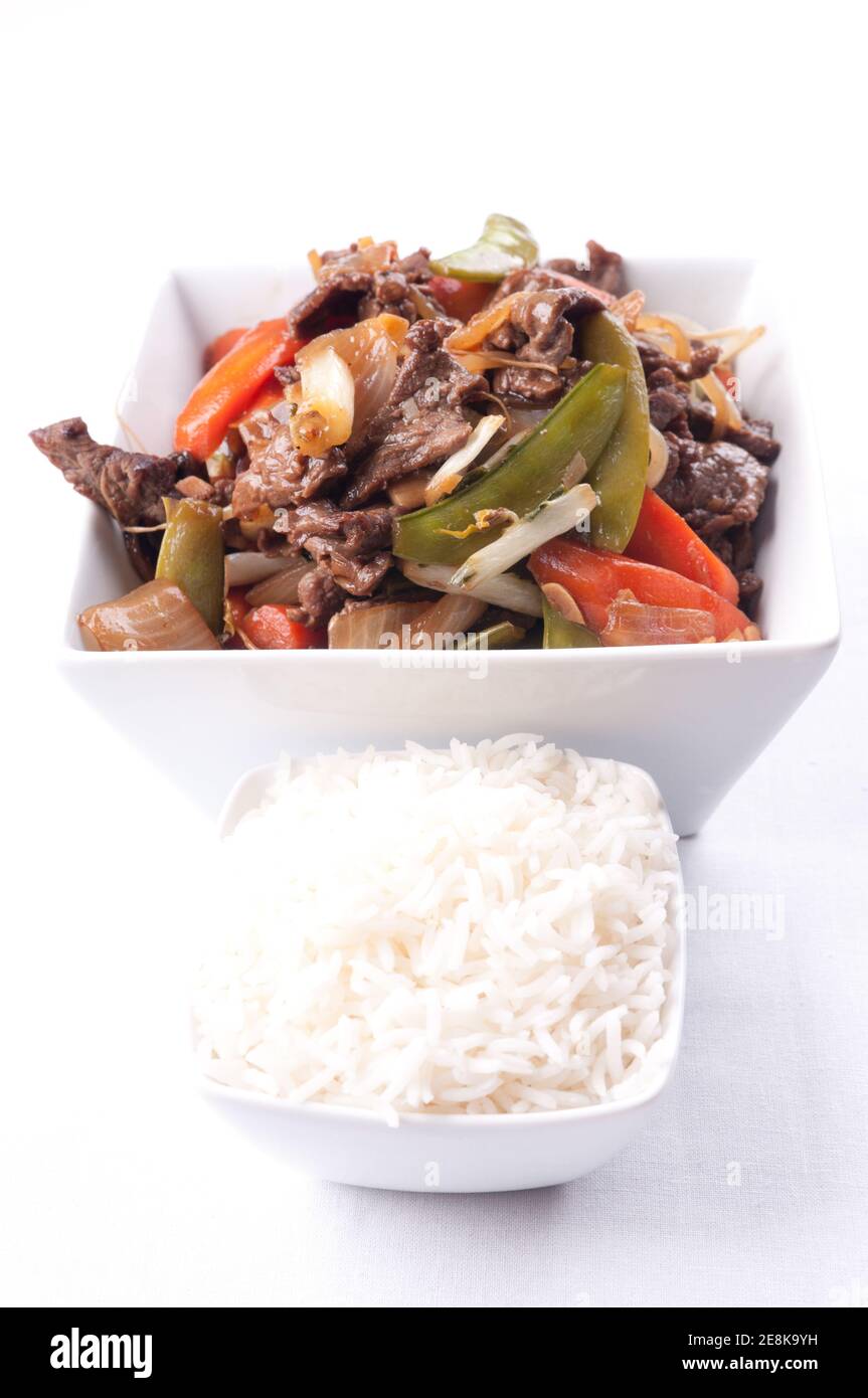 Homemade beef stir fry with flank steak, fresh vegetables, and cilantro