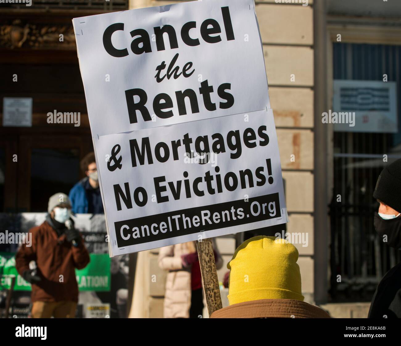 Boston, Massachusetts, USA. 30th Jan 2021:  Cancel the Rents & Mortgages demonstration.  About 50 Boston Residents gathered on a cold winter day during a National Day of Action to call for rents and mortgages be canceled due to the financial insecurity caused by the Coronavirus, COVID-19, pandemic. Credit: Chuck Nacke/Alamy Live News Stock Photo