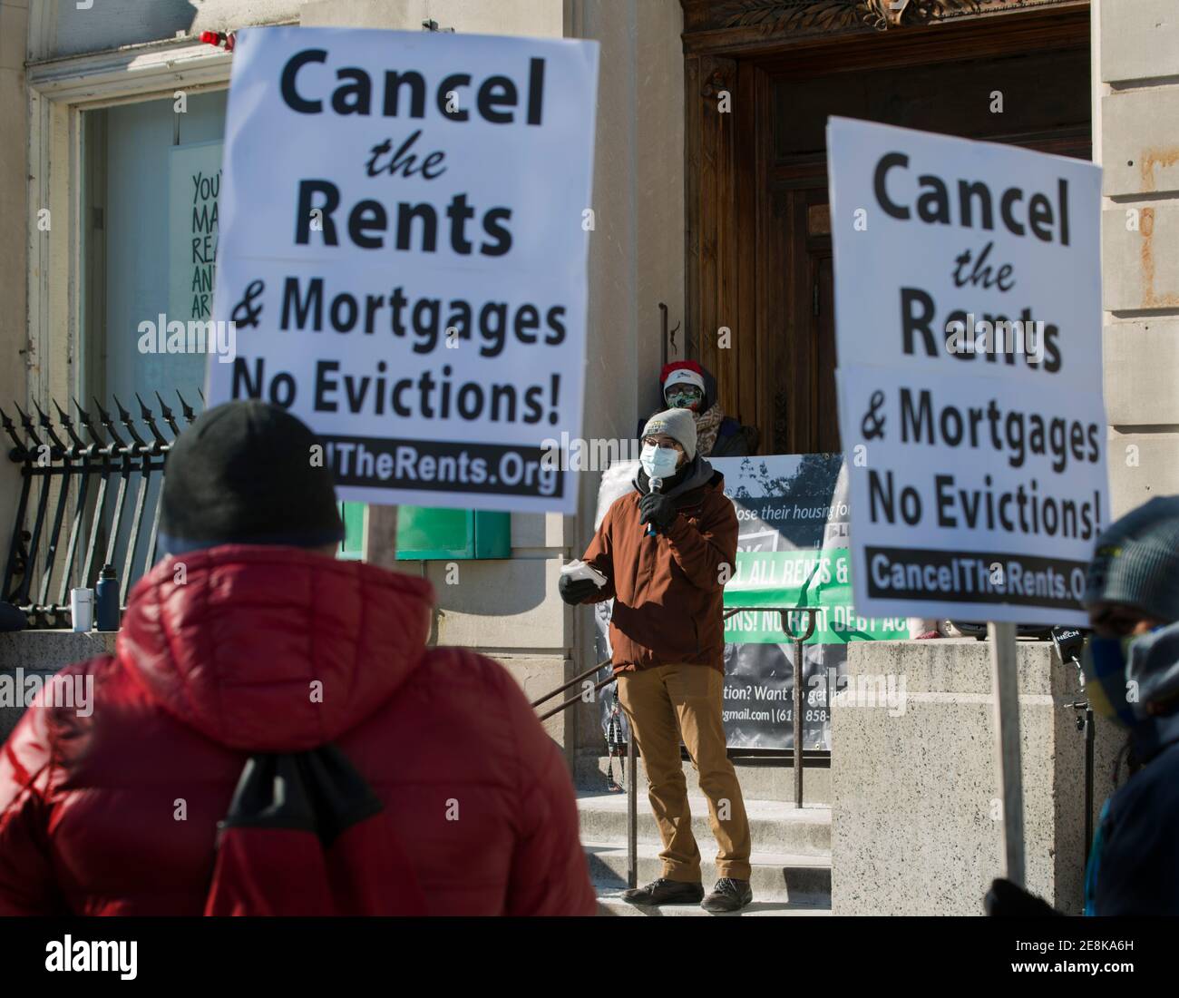 Boston, Massachusetts, USA. 30th Jan 2021:  Cancel the Rents & Mortgages demonstration.  About 50 Boston Residents gathered on a cold winter day during a National Day of Action to call for rents and mortgages be canceled due to the financial insecurity caused by the Coronavirus, COVID-19, pandemic. Credit: Chuck Nacke/Alamy Live News Stock Photo