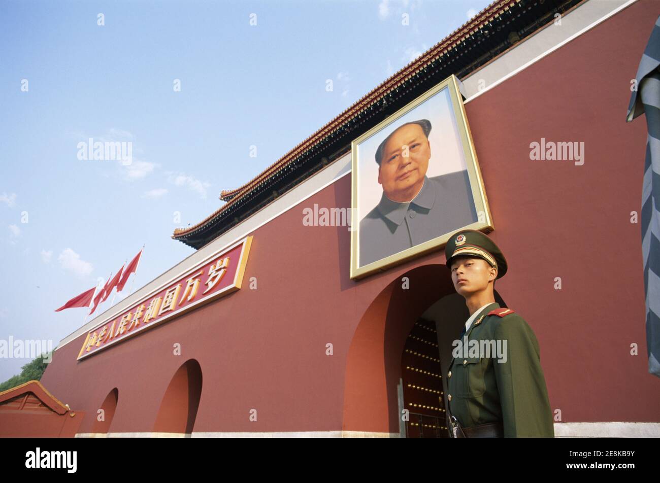 Asia China, Beijing, Tiananmen Square, Tiananmen Gate, Guard Standing under Mao Zedong Portrait Stock Photo