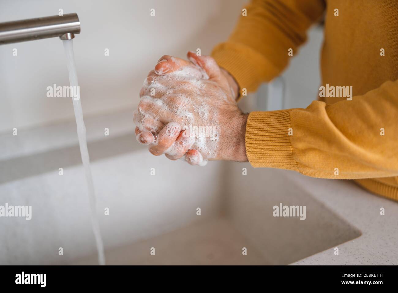 Washing hands with antibacterial gel man for corona virus prevention, hygiene Stock Photo
