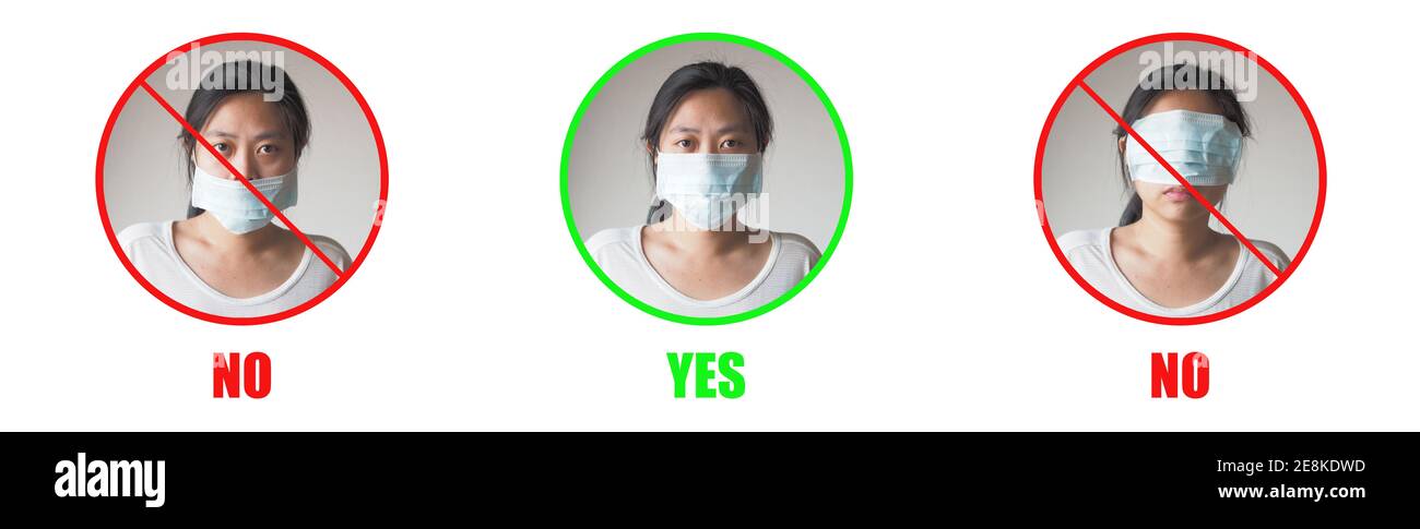 Young Asian woman showing how to wearing protective mask correctly on white background. Red circle are wrong and Green circle is right way to avoiding Stock Photo
