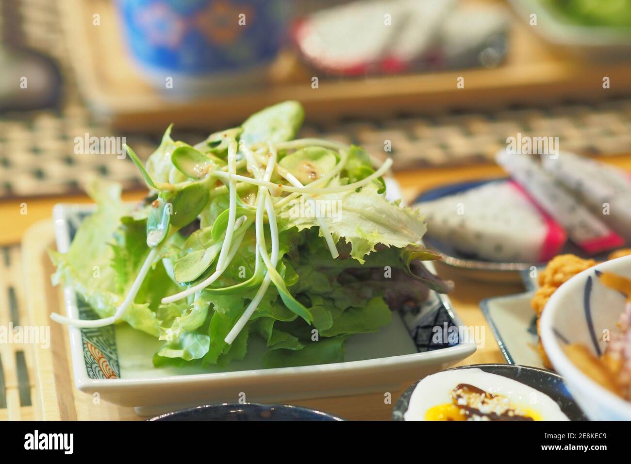 Vegetable Salad include frillice iceberg lettuce and sunflower sprout with Japanese Sesame Dressing - Breakfast set Japanese style Stock Photo