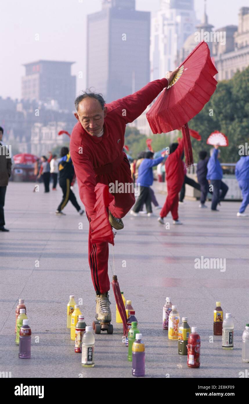 Asia,China, Shanghai, The Bund, Elderly Man Rollerskating Stock Photo