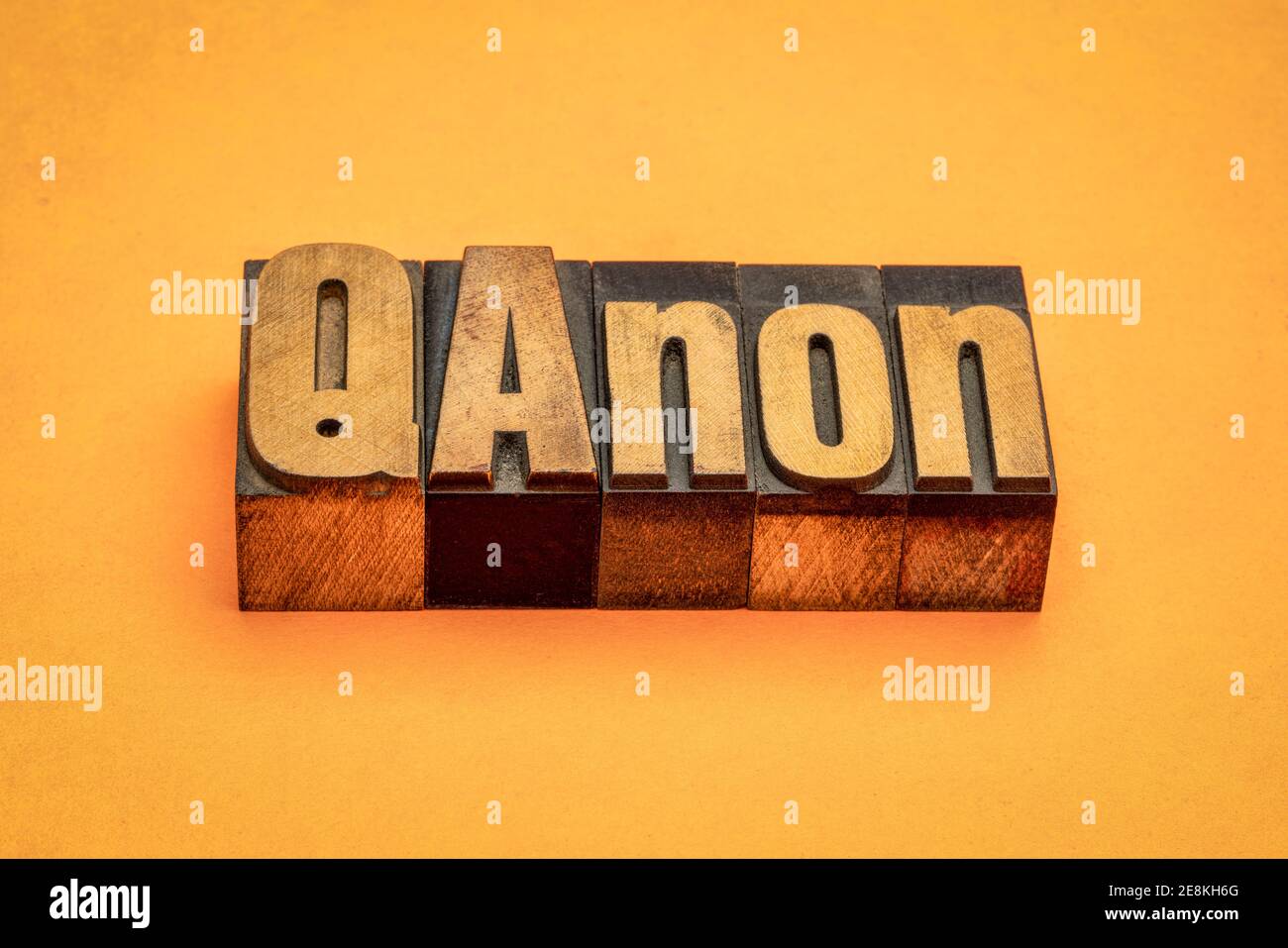 QAnon word abstract in vintage letterpress wood type, disproven and discredited far-right conspiracy theory Stock Photo